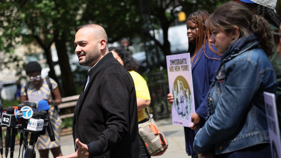 Murad Awawdeh speaks during a rally for immigrant rights.