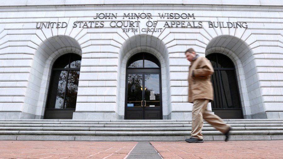 A man walks in front of the 5th U.S. Circuit Court of Appeals.