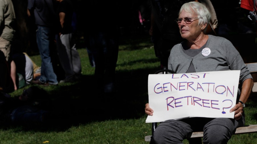 Deby Schaffer an activist associated with the Occupy Wall Street movement holds a sign expressing her concern during a gathering of the movement in Washington Square park, Saturday, Sept. 15, 2012 in New York.