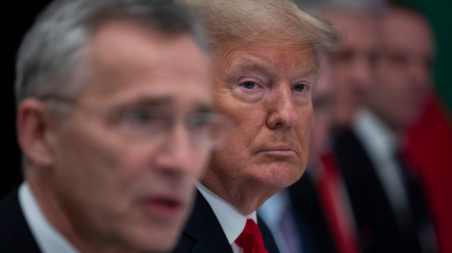 President Donald Trump listens as NATO Secretary General Jens Stoltenberg speaks during a working lunch with NATO members that have met their financial commitments to the the organization, at The Grove, Wednesday, Dec. 4, 2019, in Watford, England.