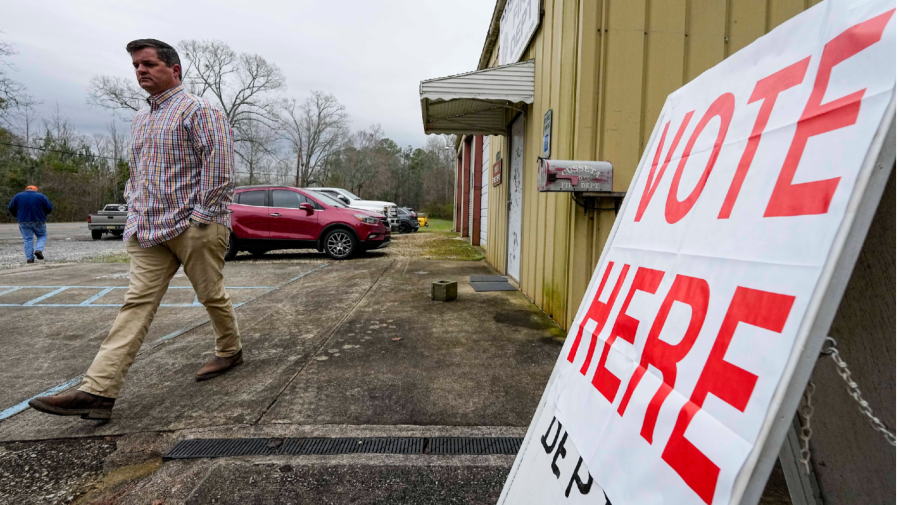 A voter enters an election station.