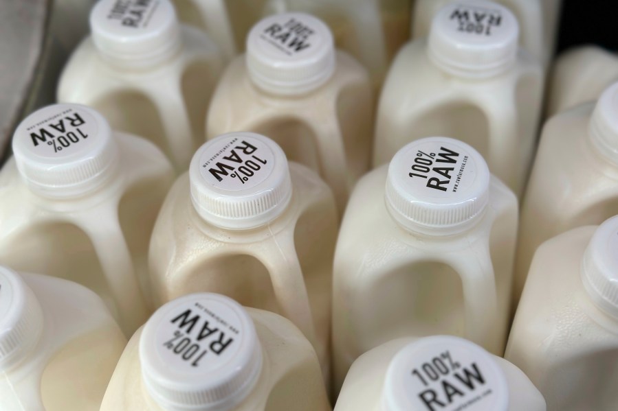 Bottles of raw milk are displayed for sale at a store in Temecula, Calif., on Wednesday, May 8, 2024. Sales of raw milk appear to be on the rise, despite an outbreak of bird flu in U.S. dairy cows. Federal officials warn about the health risks of drinking raw milk at any time, but especially during this novel outbreak. (AP Photo/JoNel Aleccia)