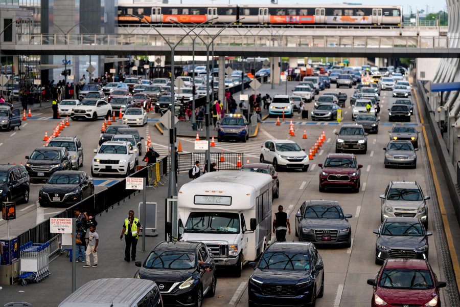 Cars drive through Hartsfield-Jackson Atlanta International Airport ahead of Memorial Day, Friday, May 24, 2024, in Atlanta.(AP Photo/Mike Stewart)