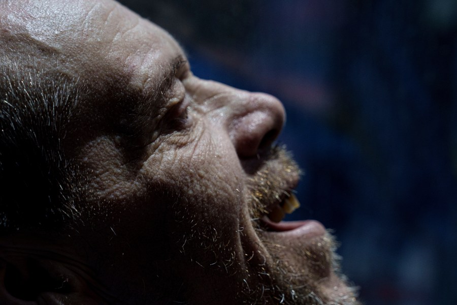 A Ukrainian serviceman reacts after returning from captivity during POWs exchange in Sumy region, Ukraine, Friday, May 31, 2024. Ukraine returned 75 prisoners, including four civilians, in the latest exchange of POWs with Russia. It's the fourth prisoner swap this year, and 52nd since Russia invaded Ukraine. In all, 3 210 Ukrainian servicemen and civilians were returned since the outbreak of the war. (AP Photo/Evgeniy Maloletka)