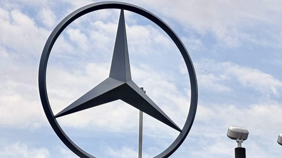 The Mercedes emblem is displayed outside.