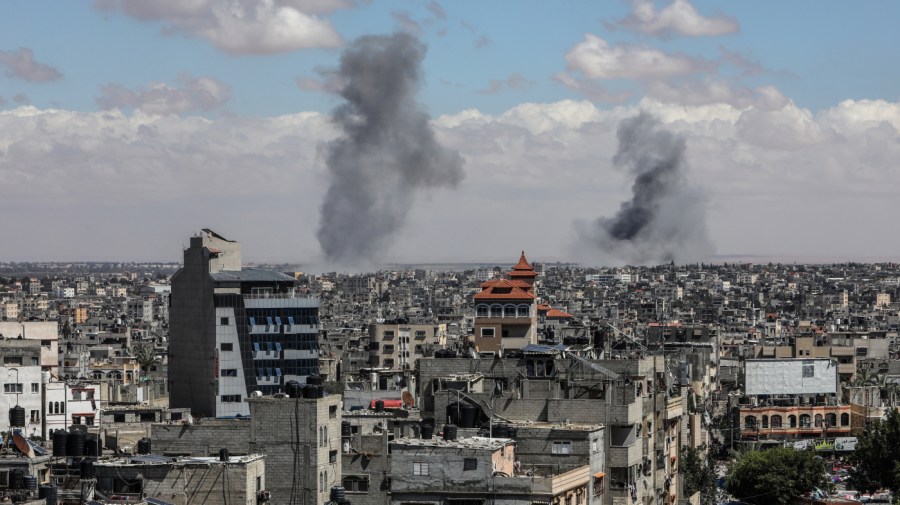 Smoke rises from different points of the skyline after an Israeli attack on Rafah.