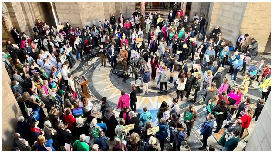 Hundreds of people crowded the Nebraska state Capitol Rotunda in a protest.