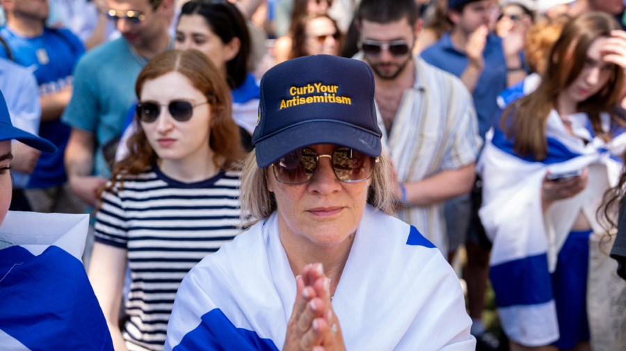 A woman wears a hat that reads "Curb Your Antisemitism" during a rally against campus antisemitism at George Washington University on May 2, 2024 in Washington, D.C.