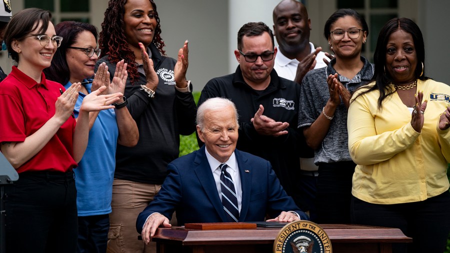 President Biden, surrounded by union workers, signs documents that increase tariffs on aluminum, steal and electric vehicles from China