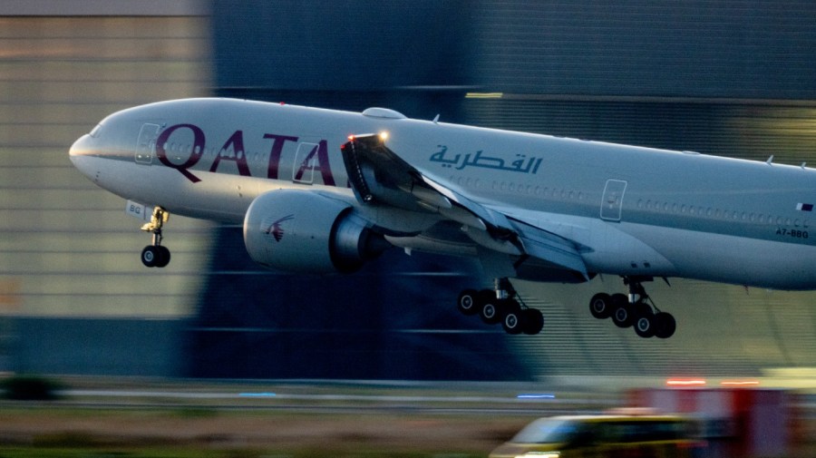 FILE - A Qatar airways plane lands at the airport in Frankfurt, Germany, as the sun rises on Sept. 25, 2023. Twelve people were injured when a Qatar Airways plane flying from Doha to Dublin on Sunday May 26, 2024 hit turbulence, airport authorities said. (AP Photo/Michael Probst, File)