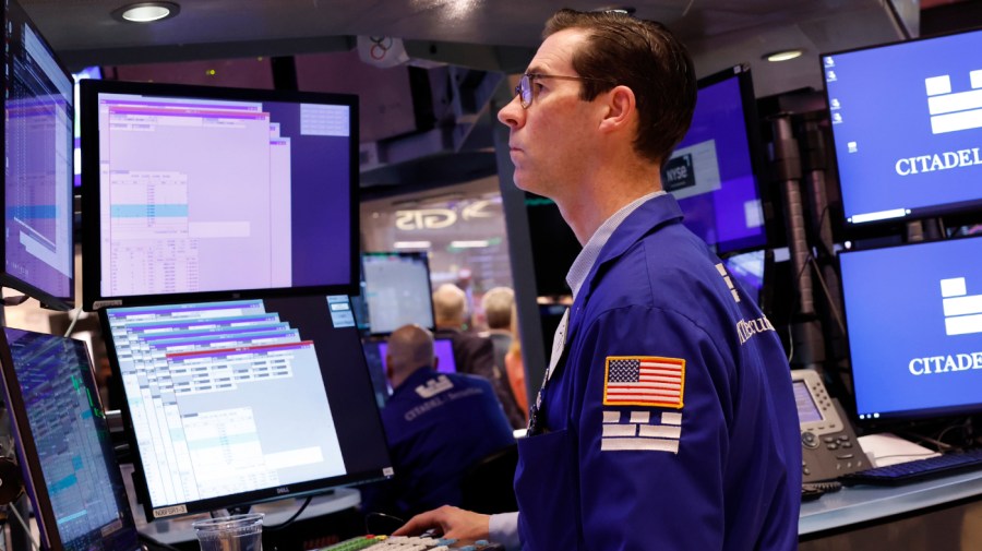 Traders work on the floor of the New York Stock exchange during morning trading on May 17, 2024 in New York City.