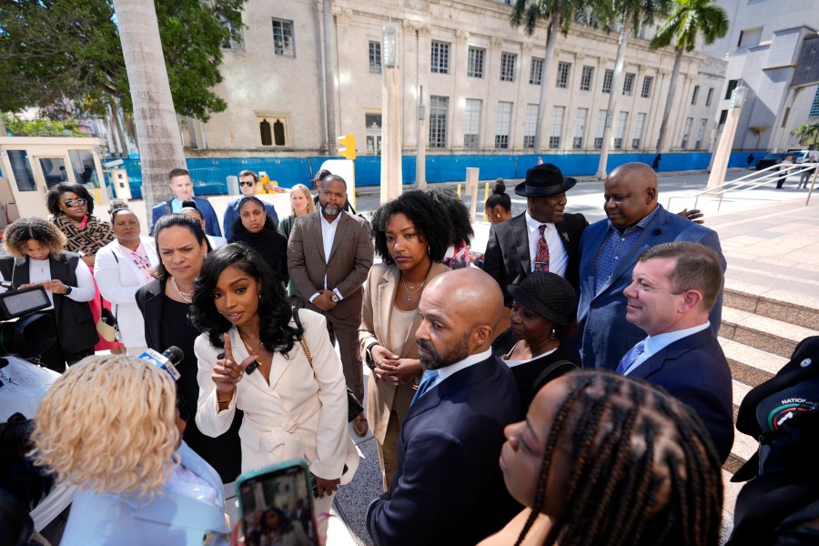 FILE - Co-founders and CEOs of The Fearless Fund Arian Simone, center left, and Ayana Parsons, center right, speak to journalists outside federal court in Miami, on Jan. 31, 2024. A U.S. federal court of appeals panel suspended the venture capital firm's grant program for Black women business owners, ruling that a conservative group is likely to prevail in its lawsuit claiming that the program is the discriminatory. (AP Photo/Rebecca Blackwell, File)