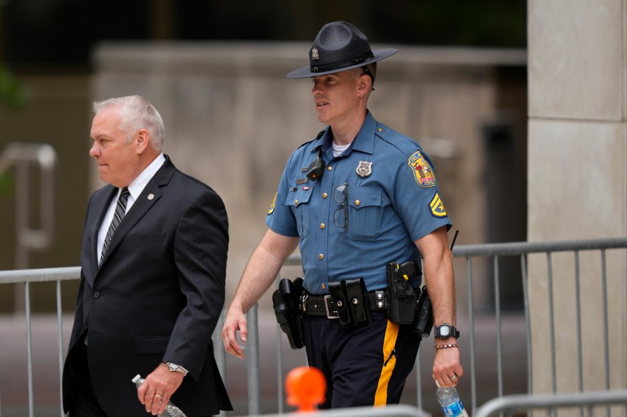 Delaware State Police trooper Joshua Marley, right, departs from federal court, Thursday, June 6, 2024, in Wilmington, Del. (AP Photo/Matt Slocum)