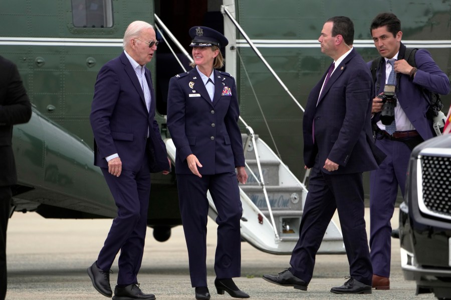 President Joe Biden talks with Air Force Col. Angela Ochoa, Commander, 89th Airlift Wing, as he arrives at Andrews Air Force Base, Md., on Marine One Monday, June 10, 2024. (AP Photo/Manuel Balce Ceneta)