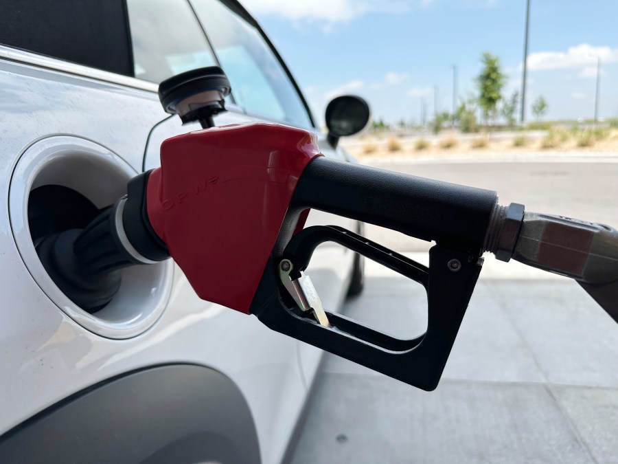 A motorist fills up the tank of a vehicle at a gasoline pump at a Costco warehouse Friday, May 31, 2024, in Aurora, Colo. Gas prices are once again on the decline across the U.S. — bringing some ease to drivers at a time of year when it usually costs a little more to fill up your tank. (AP Photo/David Zalubowski)