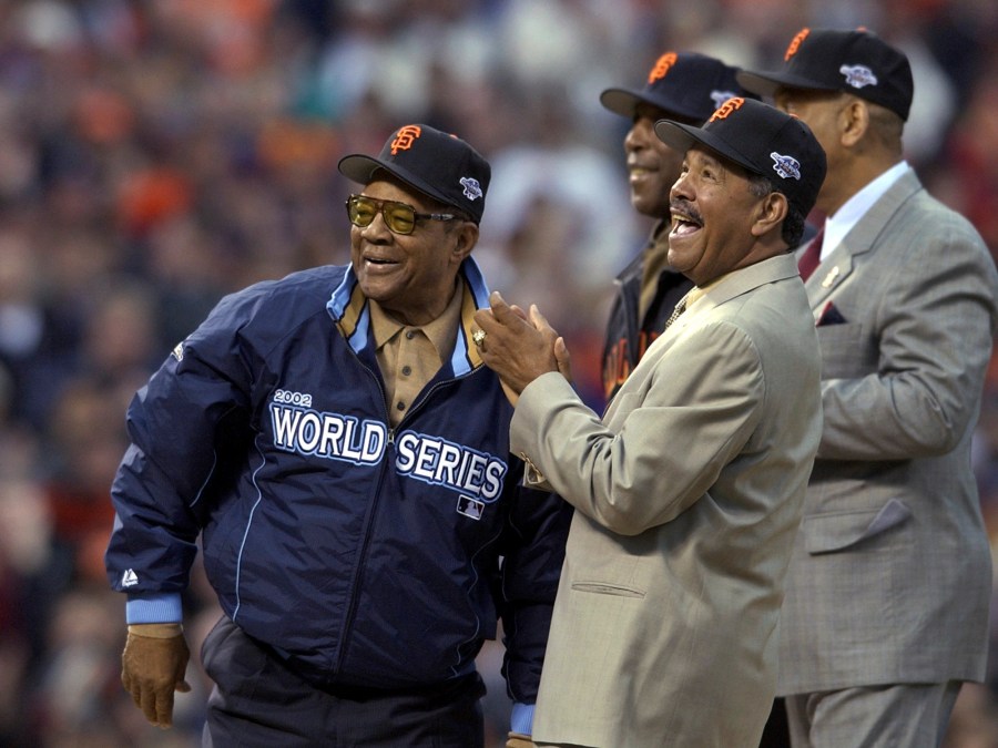 FILE - Willie Mays, left, is joined by former San Francisco Giants' Orlando Cepeda, right, Willie McCovey and Juan Marichal, front, before Game 3 of the World Series between the Giants and the Anaheim Angels in San Francisco,Oct. 22, 2002. Mays, the electrifying “Say Hey Kid” whose singular combination of talent, drive and exuberance made him one of baseball’s greatest and most beloved players, has died. He was 93. Mays' family and the San Francisco Giants jointly announced Tuesday night, June 18, 2024, he had “passed away peacefully” Tuesday afternoon surrounded by loved ones. (AP Photo/Kevork Djansezian, File)