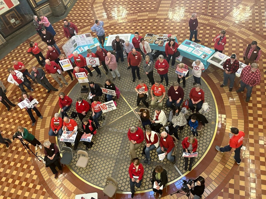 Opponents of Summit Carbon Solutions' proposed carbon dioxide pipeline gather at the state Capitol in Des Moines, Iowa, on Feb. 8, 2024. The Iowa Utilities Board on Tuesday, June 25, 2024, approved Summit's application to build its pipeline, but the company still has many hoops to jump through before it gets its permit and can begin construction. (AP Photo/Hannah Fingerhut)