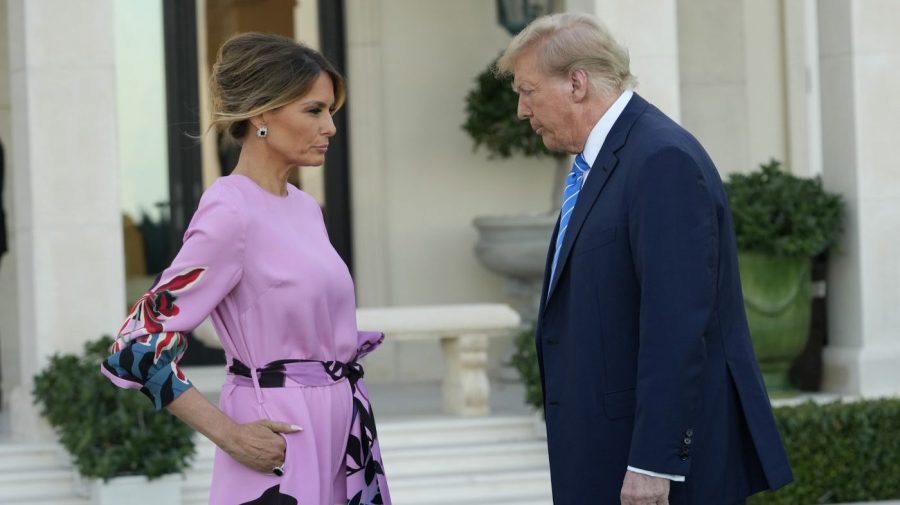 Melania and Donald Trump face each other.