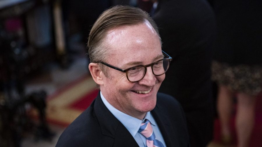 Robert Gibbs smiles at a White House event.