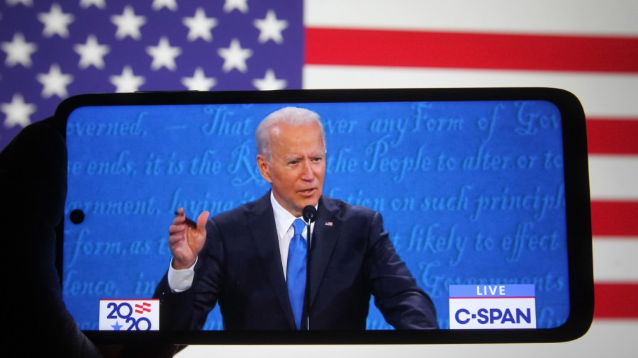 In this photo illustration the Democratic presidential candidate and former US Vice President Joe Biden is seen during the final presidential debate with US President Donald Trump (not seen) displayed on a screen of a smartphone. (Photo Illustration by Pavlo Conchar/SOPA Images/LightRocket via Getty Images)