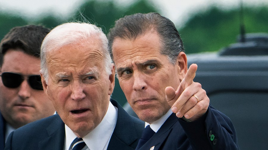 President Biden talks with his son Hunter Biden.