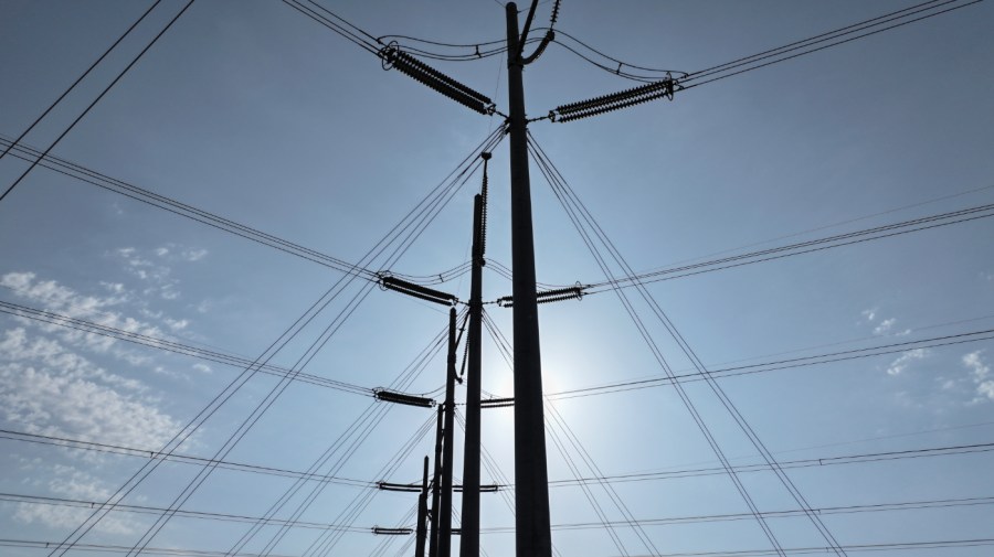 In an aerial view, high voltage power lines run along the electrical power grid on May 16, 2024, in West Palm Beach, Florida. The grid is strained by increasing demand from electricity-hungry data centers and electric vehicles, disruptions due to severe weather events, and more. The Federal Energy Regulatory Commission recently issued a sweeping reform to transmission grid planning in an effort to improve the nation's aging power grid. (Photo by Joe Raedle/Getty Images)