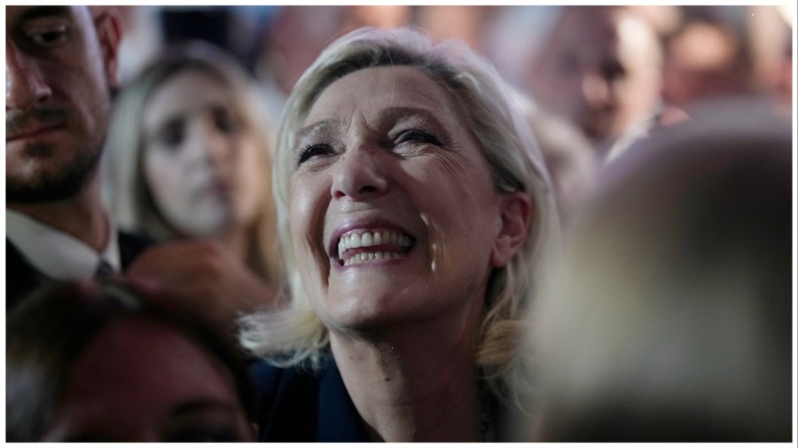 French far right leader Marine Le Pen reacts as she meets supporters and journalists after the release of projections based on the actual vote count in select constituencies , Sunday, June 30, 2024 in Henin-Beaumont, northern France. (AP Photo/Thibault Camus)