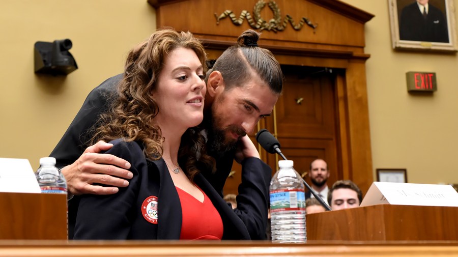 Former Olympic swimmer Michael Phelps speaks with Allison Schmitt