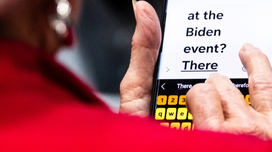 An attendee sends a text message during an event with US President Joe Biden, not pictured, at the Wilmington Convention Center in Wilmington, North Carolina, US, on Thursday, May 2, 2024. (Photographer: Cornell Watson/Bloomberg via Getty Images)