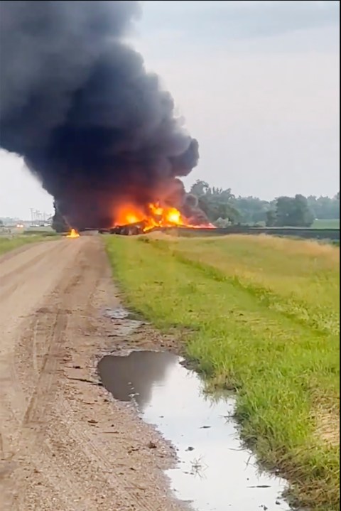 This photo provided by Doug Zink, smoke fills the sky after a train derailment on Friday, July 5, 2024 near Carrington, N.D. Rail cars containing hazardous material derailed and burst into flames early Friday in a remote area of North Dakota, but emergency officials say no one was hurt and the threat to those living nearby appears to be minimal. (Doug Zink via AP)