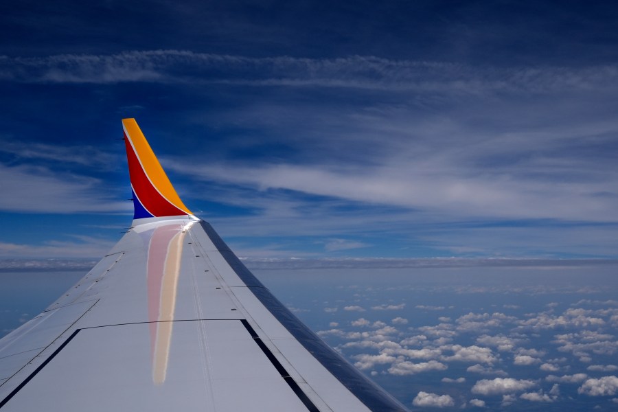 FILE - A Southwest Airlines Boeing 737 Max 8 passenger jet flies over the central United States heading for Chicago from Tulsa, Okla., June 15, 2024, in Tulsa. A Southwest Airlines jet that was damaged after experiencing an unusual "Dutch roll" during a flight is back in service. (AP Photo/Charles Rex Arbogast, File)