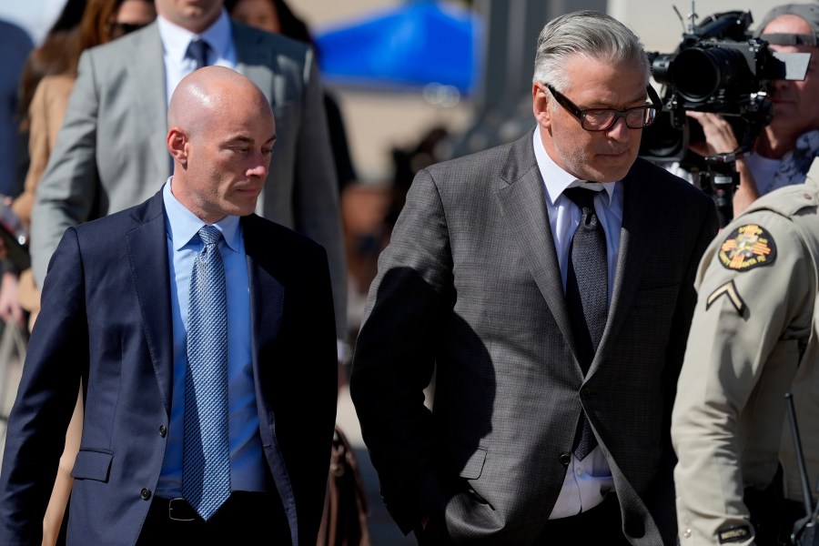 Actor Alec Baldwin, right, and attorney Luke Nikas, leave court after jury selection in Baldwin's involuntary manslaughter trial, Tuesday, July 9, 2024, in Santa Fe, N.M. (AP Photo/Ross D. Franklin)