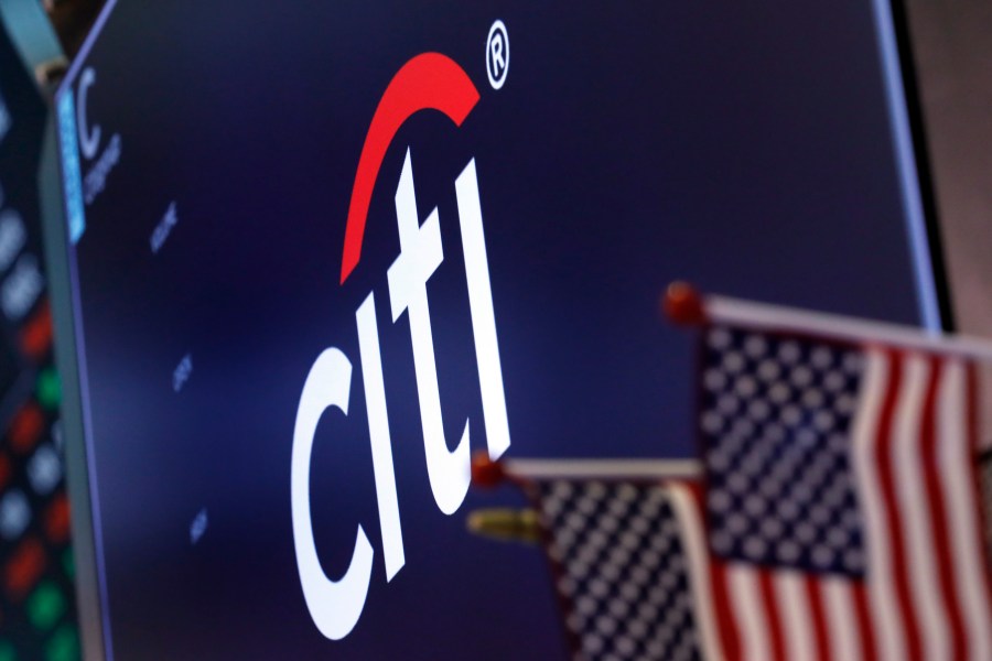 FILE - The logo for Citigroup appears above a trading post on the floor of the New York Stock Exchange on Feb. 8, 2019. A pair of government regulators slapped Citigroup with a $135.6 million on Wednesday, July 10, 2024, saying the bank has made insufficient progress in resolving longstanding internal control and risk issues. (AP Photo/Richard Drew, File)