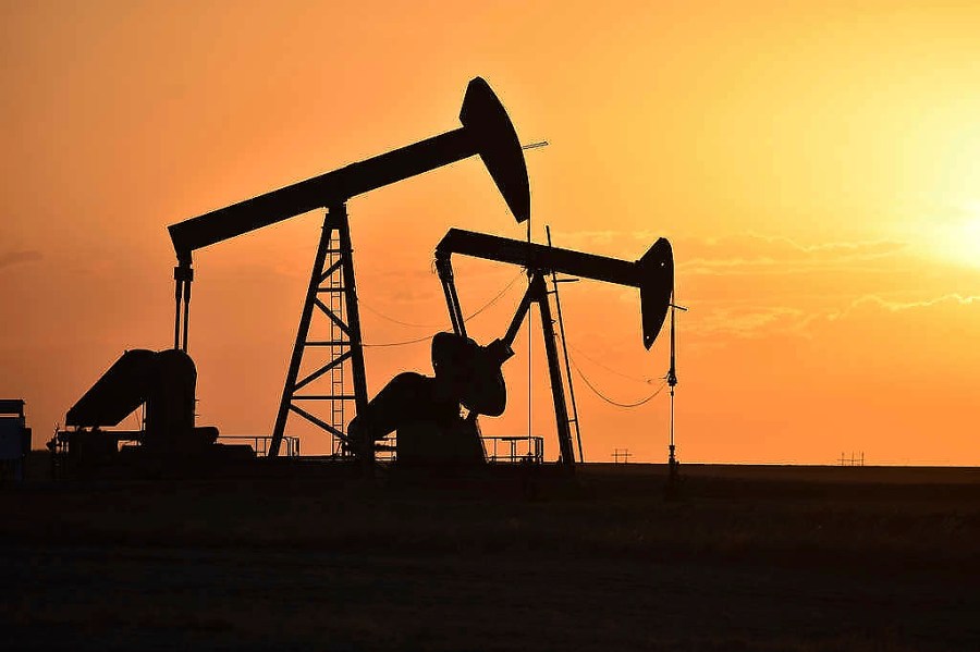 FILE - Pump jacks extract oil from beneath the ground in North Dakota, May 19, 2021. The federal government announced a $241.5 million settlement with Marathon Oil on Thursday, July 11, 2024, for alleged air quality violations at the company's oil and gas operations in the Forth Berthold Indian Reservation in North Dakota. (AP Photo/Matthew Brown, File)