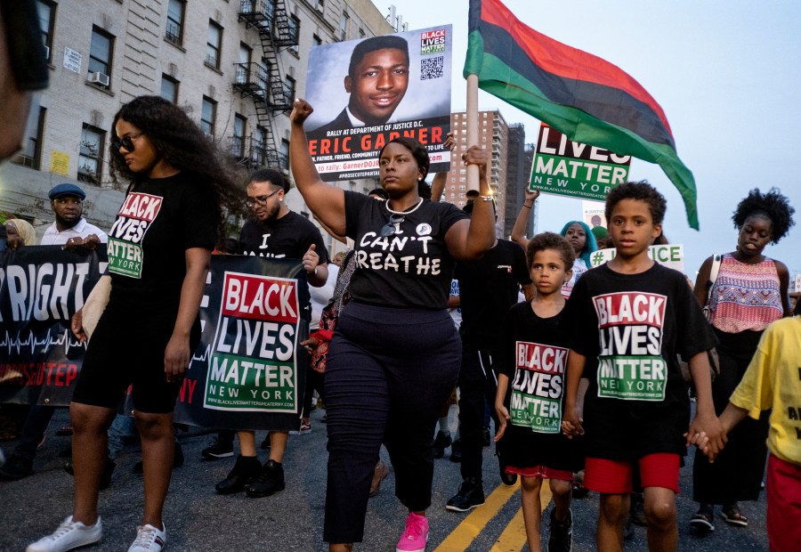 FILE - Activists with Black Lives Matter protest in the Harlem neighborhood of New York, Tuesday, July 16, 2019, in the wake of a decision by federal prosecutors who declined to bring civil rights charges against New York City police Officer Daniel Pantaleo, in the 2014 chokehold death of Eric Garner. Wednesday, July 17, 2024 marks 10 years since the chokehold death of Eric Garner at the hands of New York City police officers who were trying to arrest him for selling loose cigarettes. (AP Photo/Craig Ruttle, File)