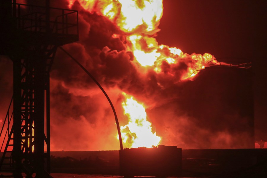 Oil tanks burn at the port in Hodeidah, Yemen, Saturday, July 20, 2024. The Israeli army said it has struck several Houthi targets in western Yemen following a fatal drone attack by the rebel group in Tel Aviv the previous day. (AP Photo)