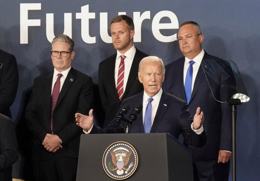 FILE - Britain's Prime Minister Keir Starmer, left, looks on as U.S. President Joe Biden speaks, where he introduced Ukrainian President Volodymyr Zelenskyy during an event on the Ukraine Compact at the NATO Summit at the Walter E. Washington Convention Center, in Washington, Thursday, July 11, 2024. Biden's withdrawal from the U.S. presidential race injects greater uncertainty into the world. (Stefan Rousseau/Pool Photo via AP, File)