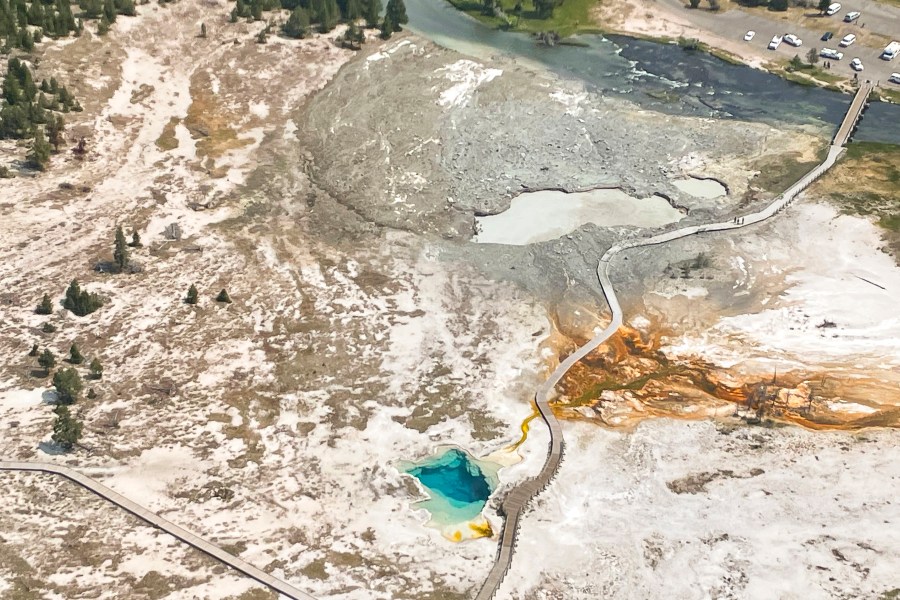 In this aerial photo released by the National Park Service, shows the damaged Biscuit Basin boardwalks after a hydrothermal explosion at Biscuit Basin in Yellowstone National Park, Wyo., Tuesday, July 23, 2024. (National Park Service via AP)