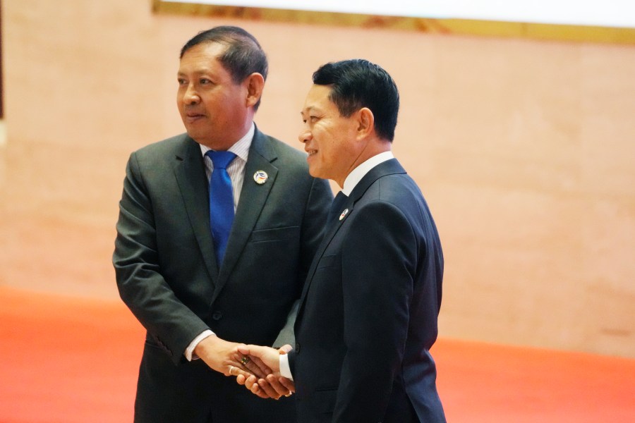 Laos' Foreign Minister Saleumxay Kommasith greets Myanmar Foreign secretary Aung Kyaw Moe, left, during the 57th ASEAN Foreign Ministers Meeting in Vientiane, Laos, Thursday, July 25, 2024. (AP Photo/Sakchai Lalit)