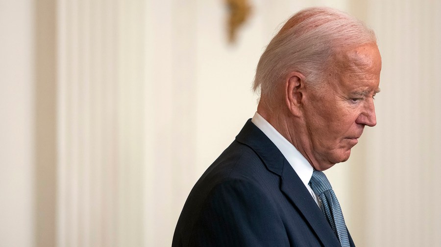 President Biden looks down during an event at the White House.