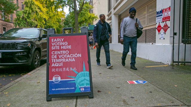 Signs indicate the location of an early voting polling site at Frank McCourt High School on the Upper West Side of Manhattan in New York City on Tuesday, November 1, 2022. (AP Photo/Ted Shaffrey)
