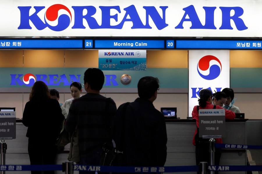 FILE - Passengers approach a Korean Air counter at Gimpo airport in Seoul, South Korea, Oct. 25, 2012. Cups of Shin Ramyun instant noodles, which have become a fan favorite among Korean Air travelers over the years, will no longer be available for Economy class passengers starting August 15, 2024, a spokesperson for the Seoul-based airline confirmed. (AP Photo/Lee Jin-man, File)