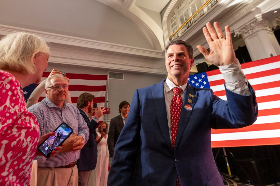 FILE - Virginia state Sen. John McGuire, a candidate in the Republican primary in the state's 5th Congressional District, joins supporters June 18, 2024, in Lynchburg, Va. (AP Photo/Skip Rowland, File)