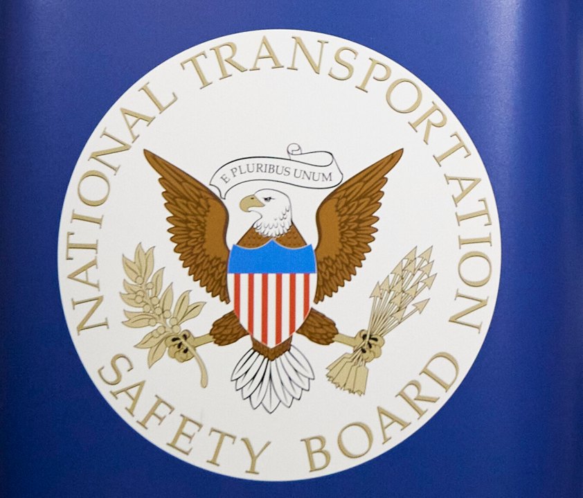 FILE - The National Transportation Safety Board logo is seen during a news conference in Portland, Ore., on Jan. 6, 2024. (AP Photo/Craig Mitchelldyer, File)