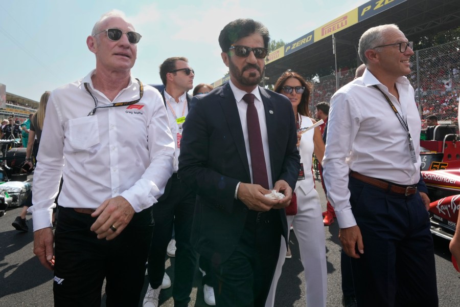 FIA president Mohammed Ben Sulayem, centre, walks through the starting grid before the Formula One Italian Grand Prix race at the Monza racetrack, in Monza, Italy, Sunday, Sept. 1, 2024. (AP Photo/Luca Bruno)