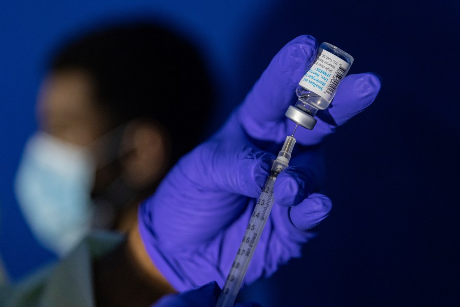 FILE - Family nurse practitioner Carol Ramsubhag-Carela prepares a syringe with the Mpox vaccine before inoculating a patient at a vaccinations site on Aug. 30, 2022, in the Brooklyn borough of New York. (AP Photo/Jeenah Moon, File)