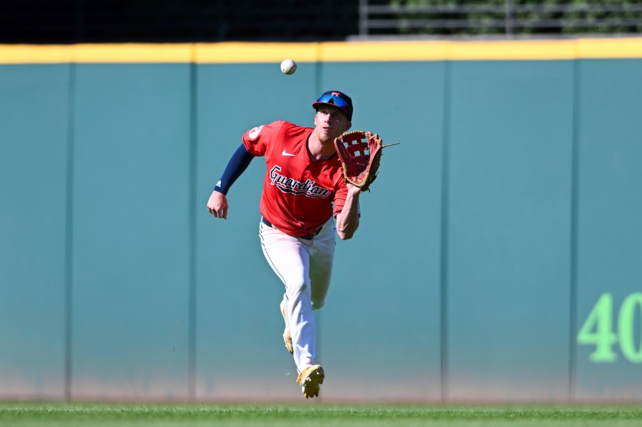 Cleveland Guardians' Myles Straw catches a fly ball during the ninth inning of a baseball game against the Minnesota Twins, Thursday, Sept. 19, 2024, in Cleveland. (AP Photo/Nick Cammett)