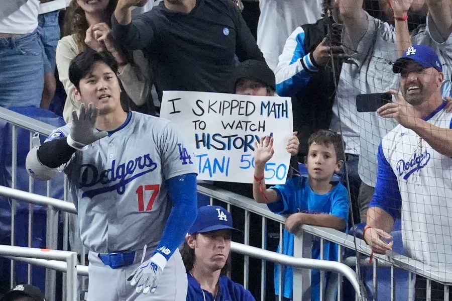 Los Angeles Dodgers' Shohei Ohtani (17) waves to fans after he hit a home run scoring Andy Pages, during the seventh inning of a baseball game against the Miami Marlins, Thursday, Sept. 19, 2024, in Miami. (AP Photo/Wilfredo Lee)