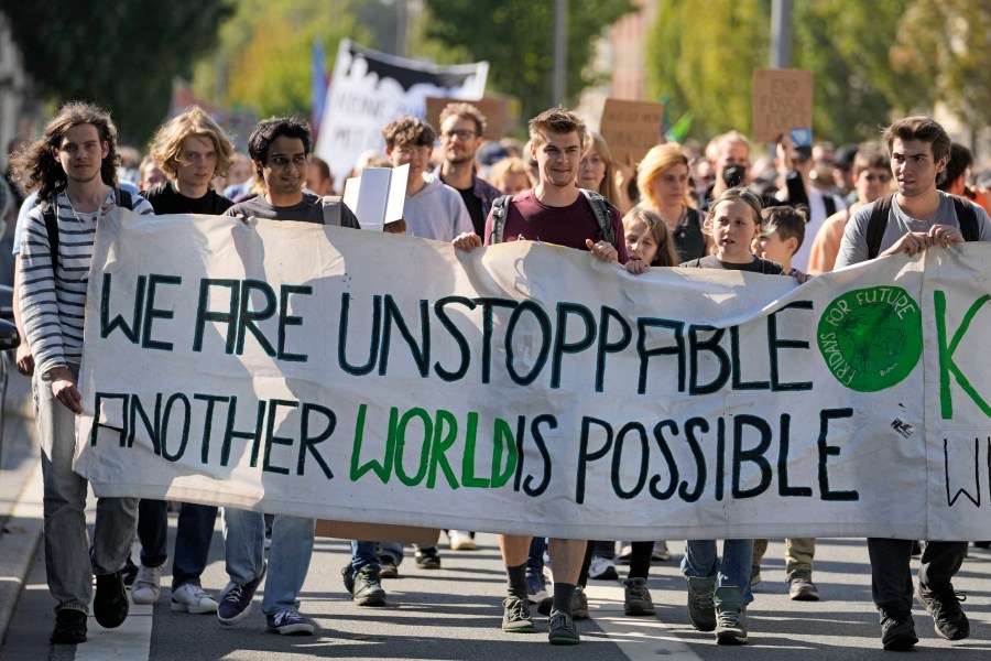 People demonstrate in the City of Bochum, western Germany, as they take part in a Global Climate Strike protest of the Fridays For Future movement on Friday, Sept. 20, 2024. (AP Photo/Martin Meissner)