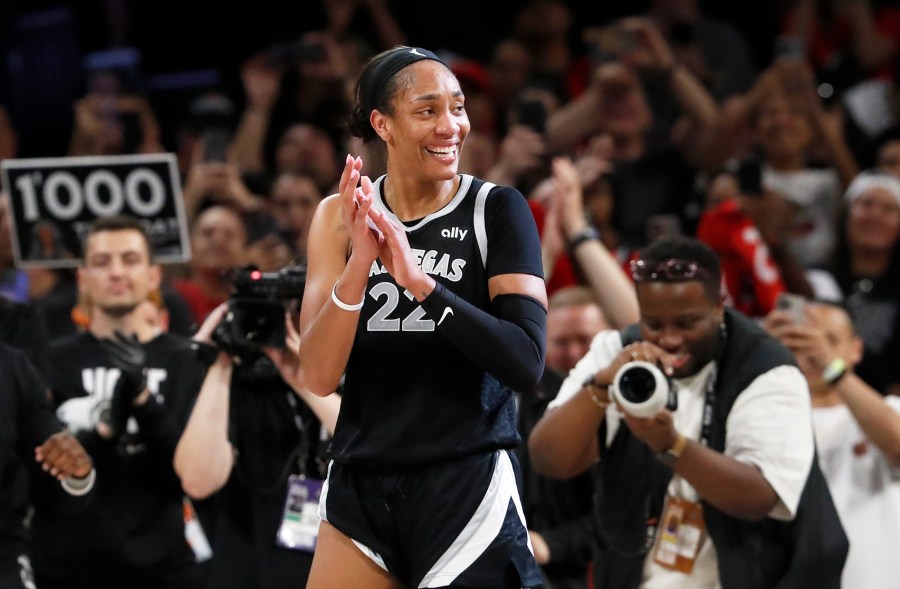 Las Vegas Aces center A'ja Wilson (22) celebrates during the second half of a WNBA basketball game against the Connecticut Sun, Sunday, Sept. 15, 2024, in Las Vegas. (Steve Marcus/Las Vegas Sun via AP)